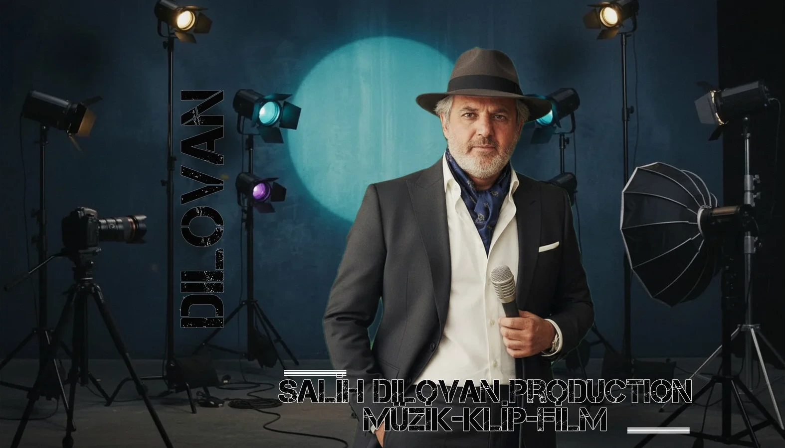 Salih Dilovan with a microphone in a studio with stage lights